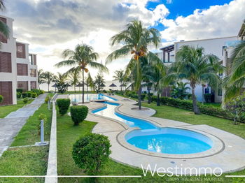 Flic en Flac - Luxueux appartement pieds dans l&#039;eau avec piscine et vue sur le lagon.