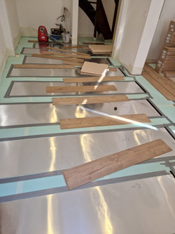 Chauffage au sol sous parquet flottant ou collé