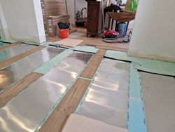 Chauffage au sol sous parquet flottant ou collé